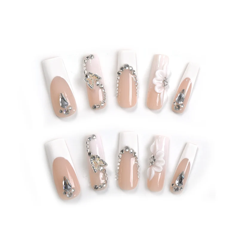Kunstnagelset mit eleganten Glitzer- und Blütenmotiven Karnz
