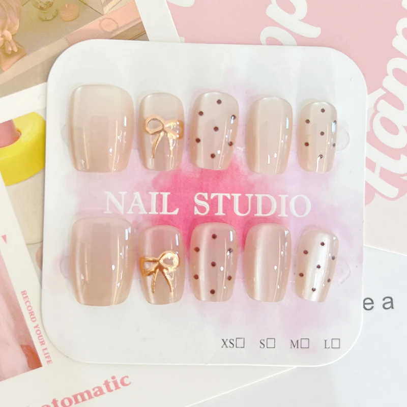 Künstliche Nagelspitzen mit eleganten Schleifenmotiven Karnz