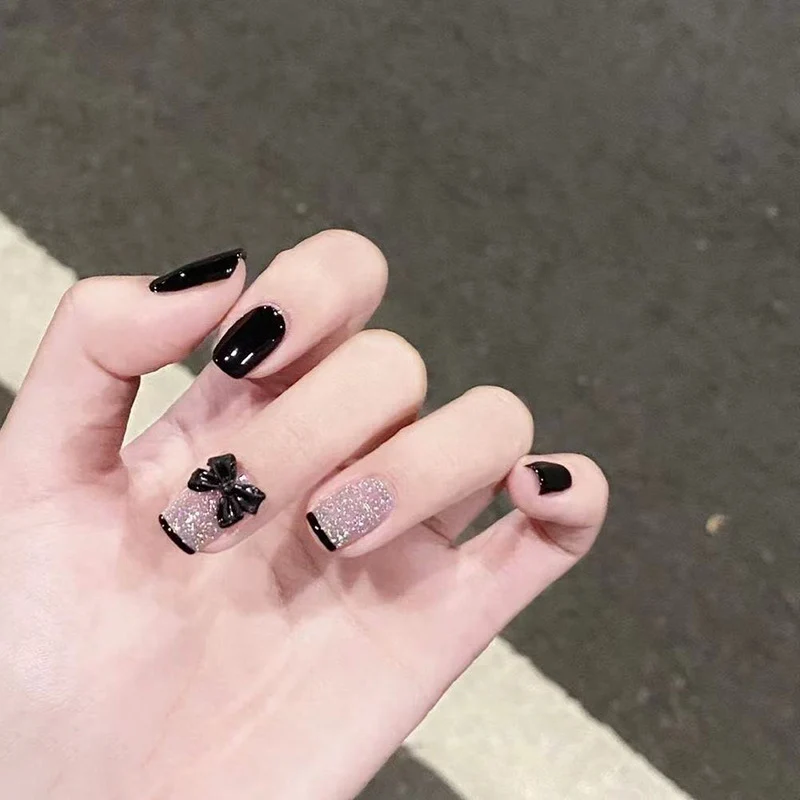 Elegante Stiletto Press-On Nail Set mit dekorativen Schleifenakzenten Karnz
