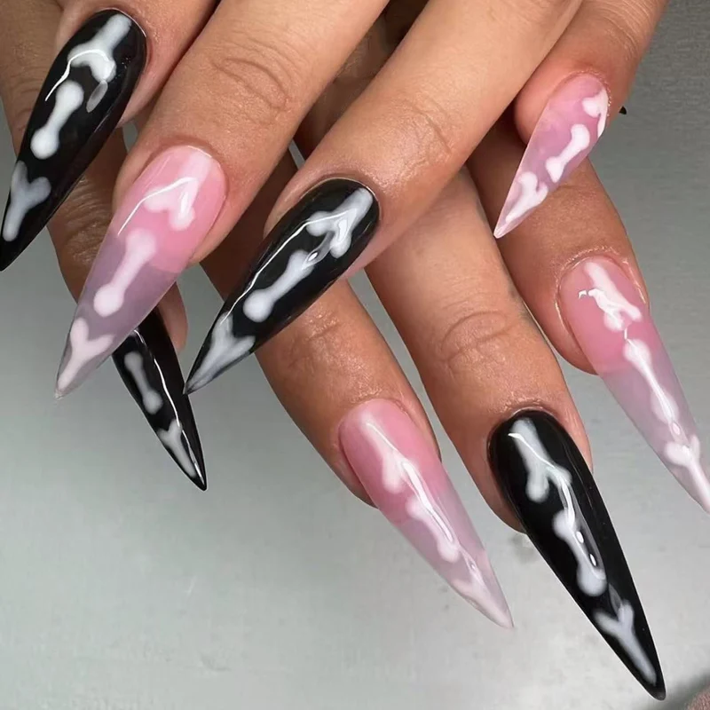 Künstlerische Stiletto Press-On Nägel mit Knochenmuster Karnz