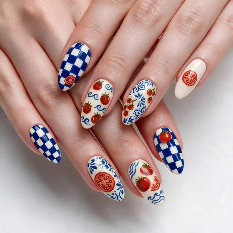 Kunstvolle Stiletto-Nägel mit fröhlichem Tomaten-Design Karnz
