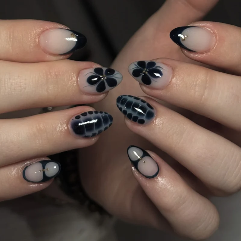 Kunstvolle Nailart im eleganten Stiletto-Design mit floralen Akzenten Karnz