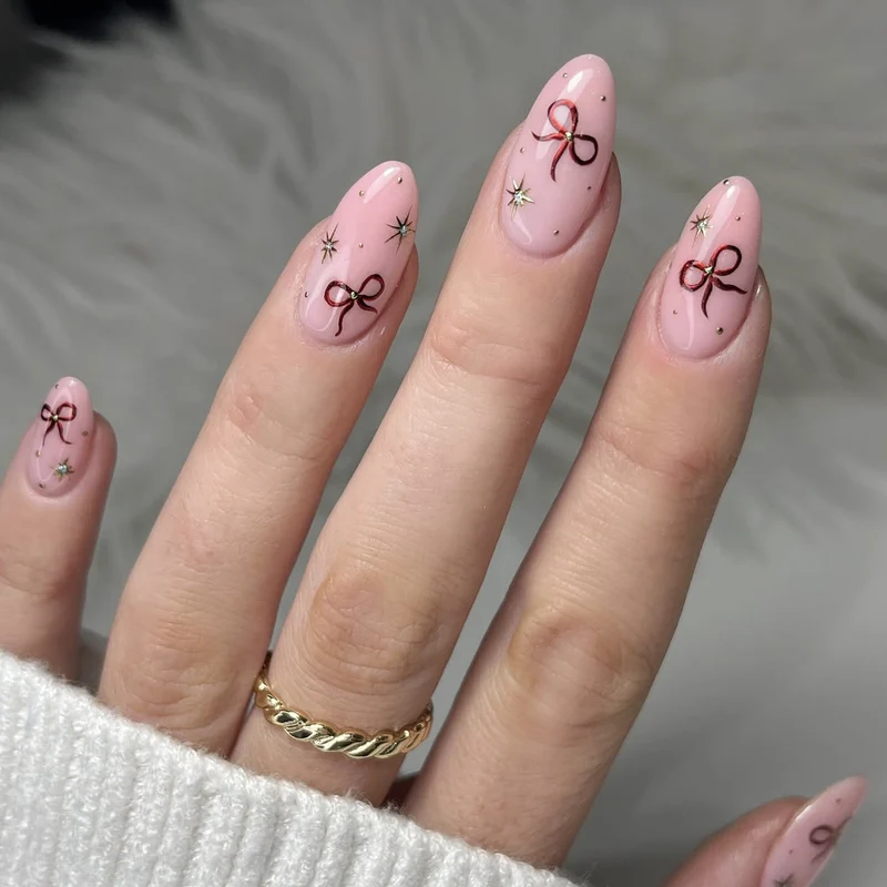 Stiletto-Nail-Art-Extensions mit Schleifenakzenten Karnz