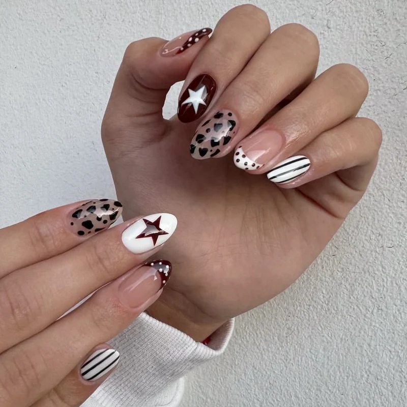 Kunstvolle Nagelgestaltung mit geometrischen Akzenten Karnz