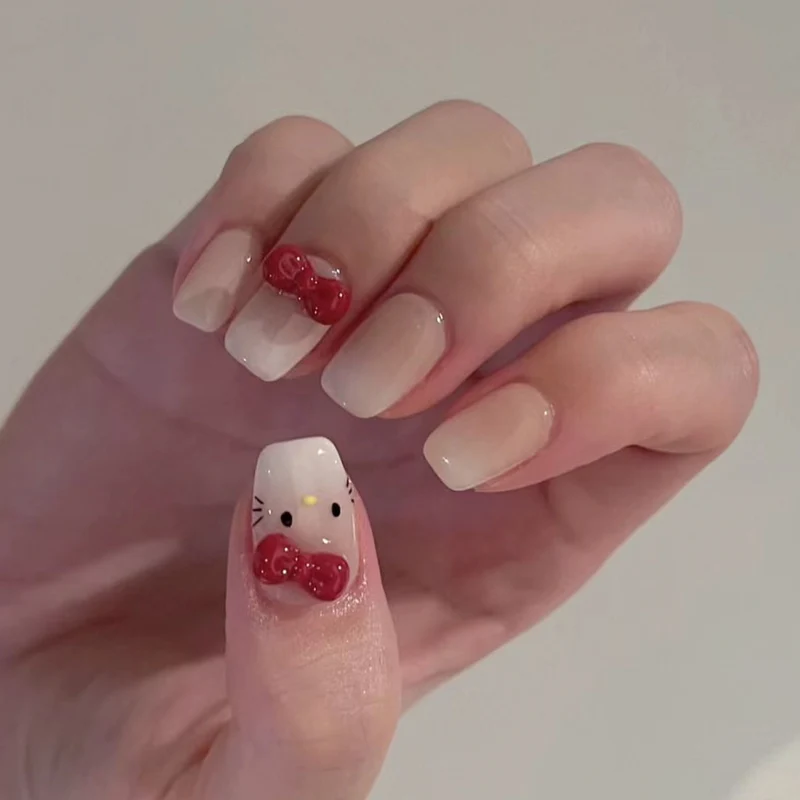 Kunstvolle Kunstnägel mit niedlichem tierischen Design und Schleifenakzenten Karnz