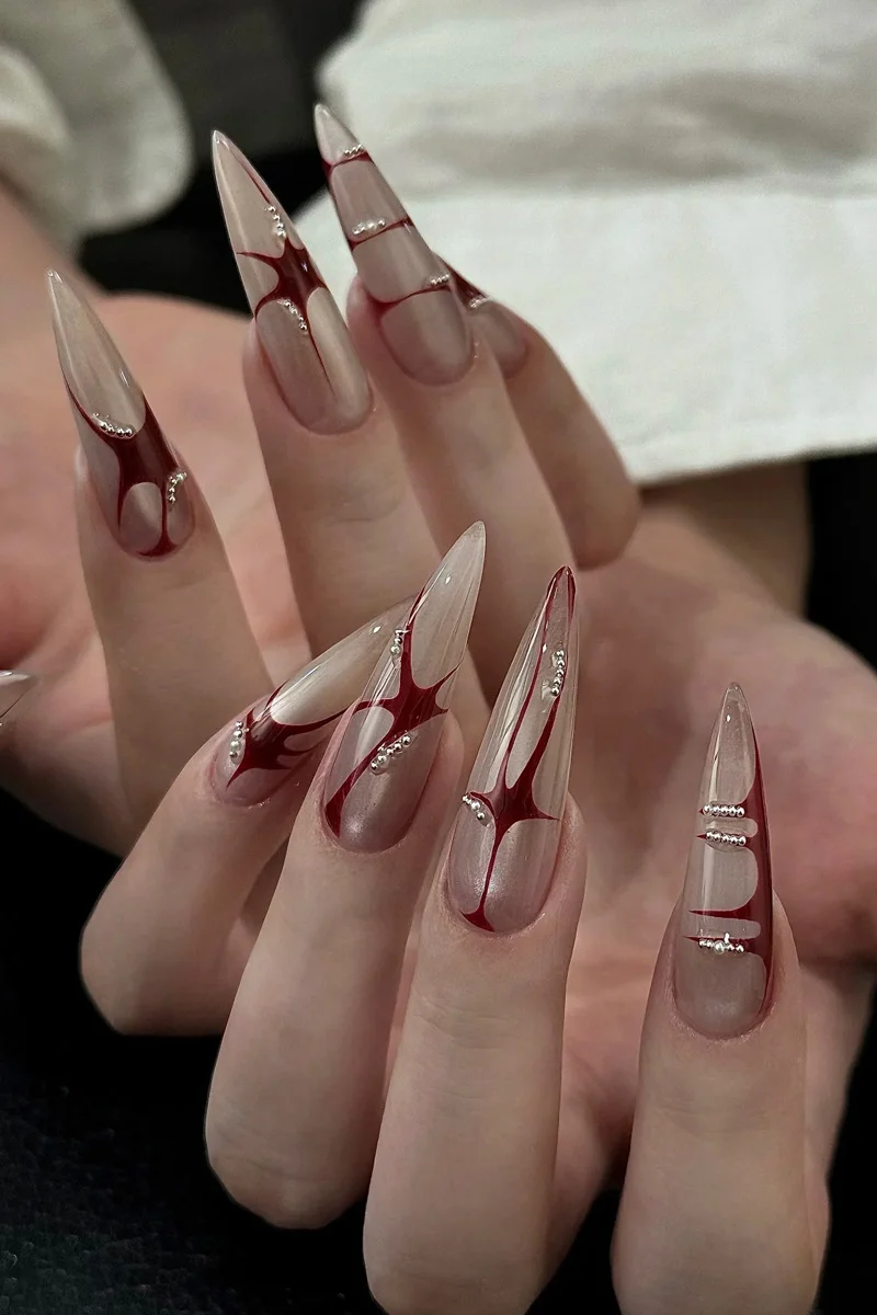 Künstlerische Stiletto Press-On-Nägel mit einzigartigem abstraktem Design Karnz