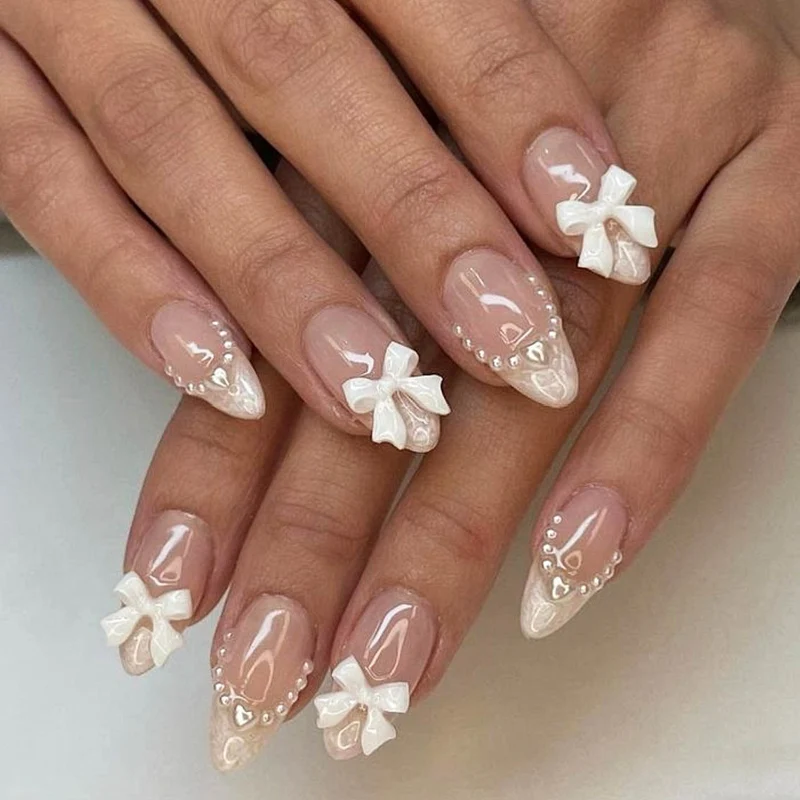Elegante mit Schleifen verzierten Acryl-Nagelerweiterungen Karnz