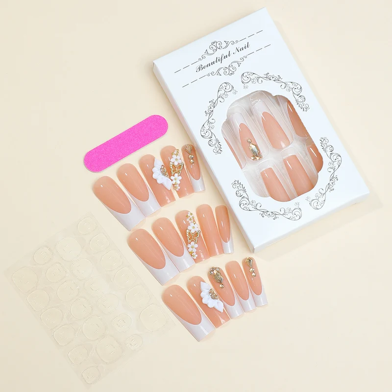 Kunstnagelset mit stilvollen Blüten- und Glitzerakzenten Karnz