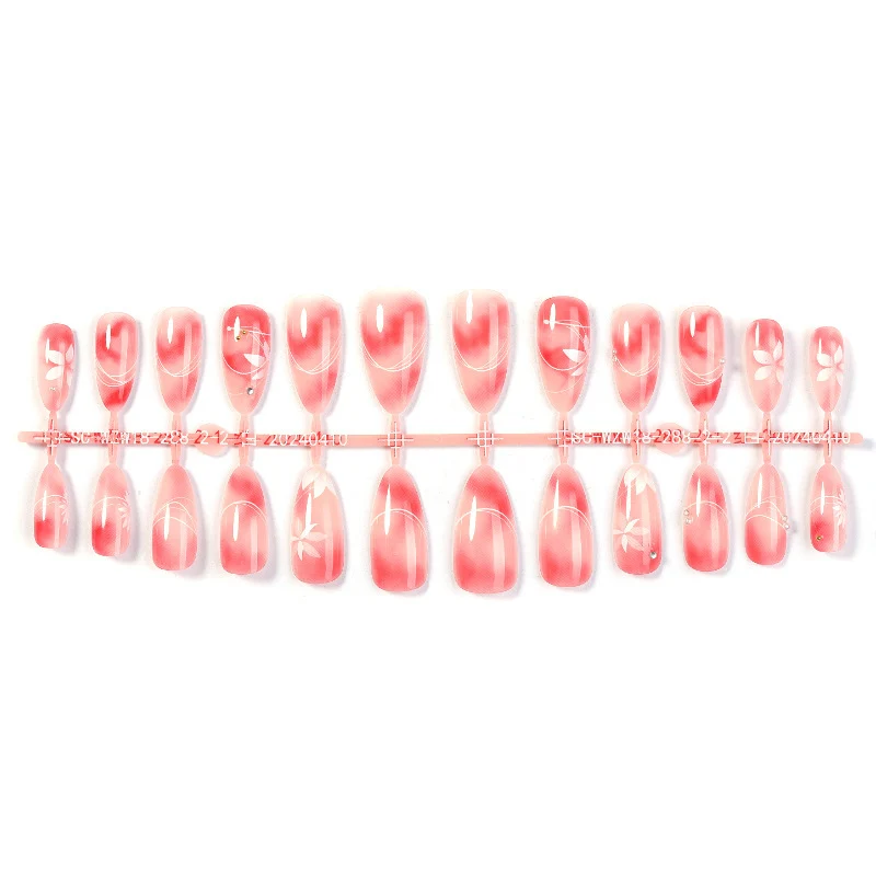 Kunstnagelset mit elegantem Ombre-Design und floralem Akzent Karnz